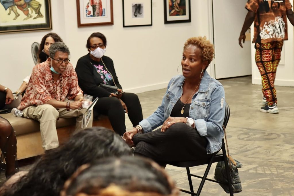 Black women speaking at a Sisters @ Eight event