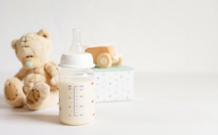 Preparation of formula for baby feeding. Baby health care, organic milk idea