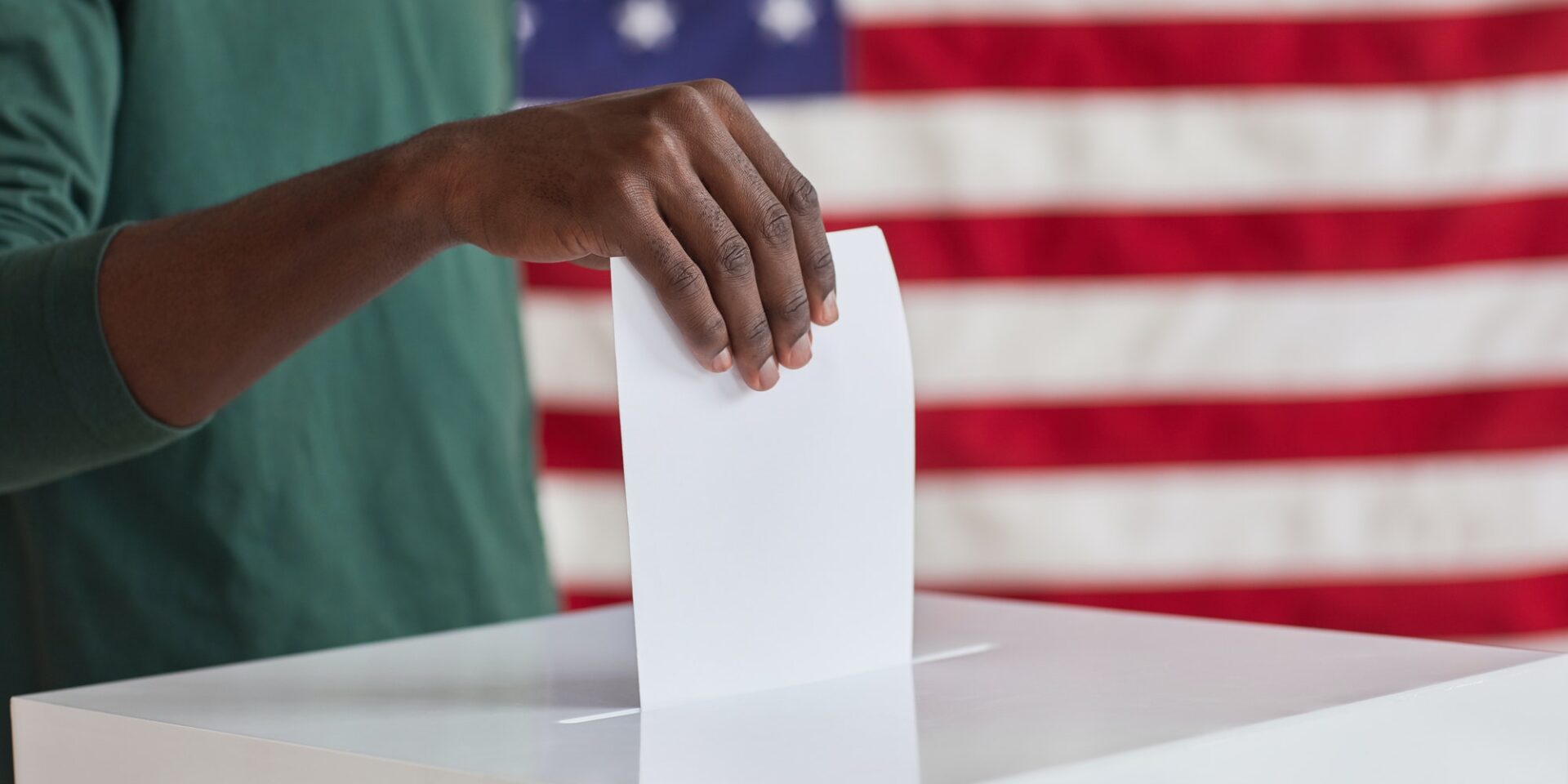 Putting ballot in the box